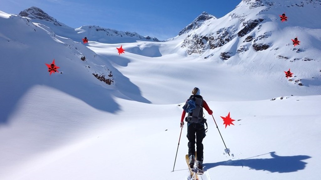 person skiing in mountains, danger zones marked